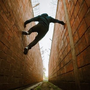 Person jumping between buildings.