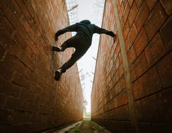 Person jumping between buildings.